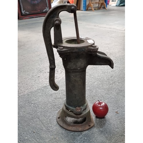 642 - An antique cast metal water pump H50cm.