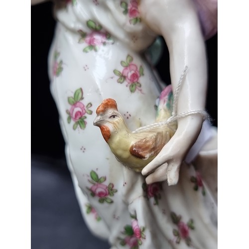 571 - A beautiful 19th century Meissen porcelain figure hold a knife and a poor chicken, ready for lunch. ... 