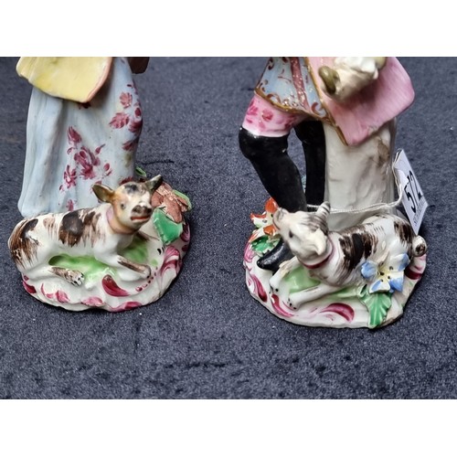 572 - Very nice pair of 19th century Staffordshire figures of a man and a woman dressed in 18th century ga... 