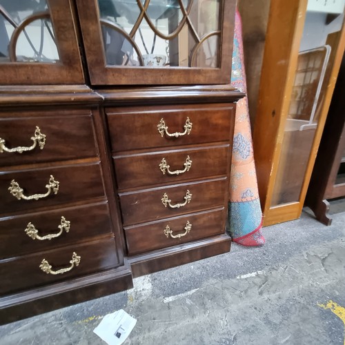 597 - Star Lot : A stunning large breakfront display cabinet with four drawers, two cupboards disguised as... 