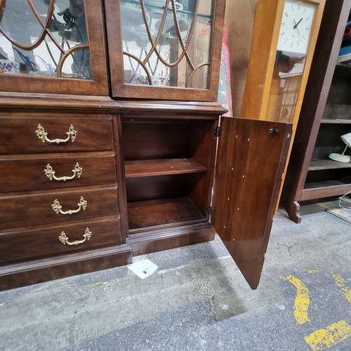 597 - Star Lot : A stunning large breakfront display cabinet with four drawers, two cupboards disguised as... 