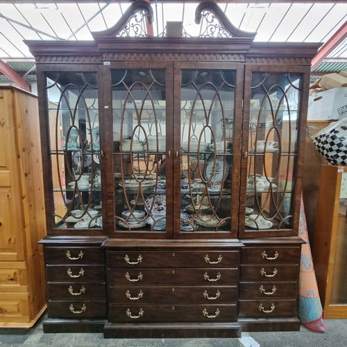 597 - Star Lot : A stunning large breakfront display cabinet with four drawers, two cupboards disguised as... 