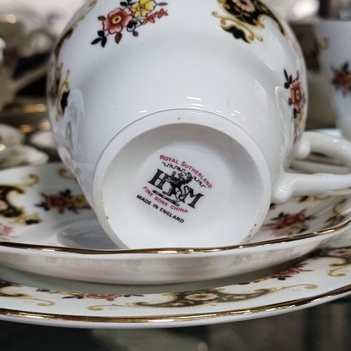 596 - Nineteen pieces Royal Sutherland fine bone china with a black and gold pattern. In