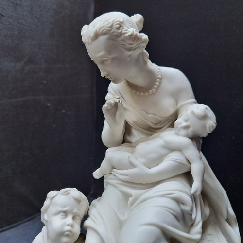 581 - Star lot : An antique Large parianware Minton sculpture of a neoclassical woman and two children res... 