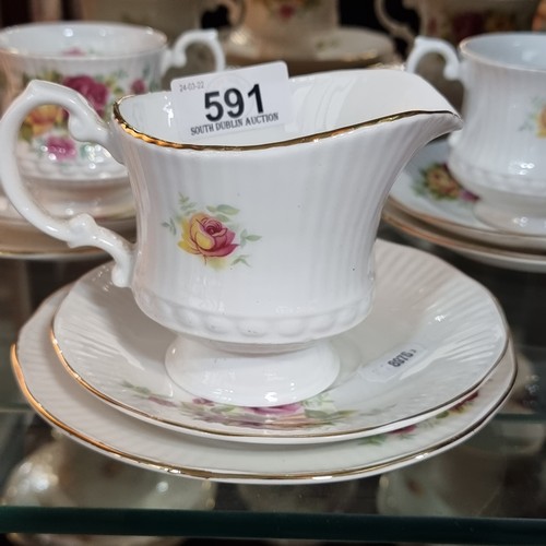 591 - Twenty one pieces of Royal Heritage china with a charming rose pattern.