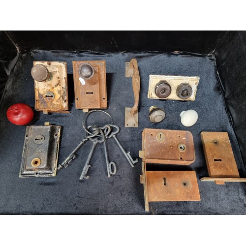 511 - A mixed lot of cast metal items including antique door handles, fittings with original keys, ceramic... 