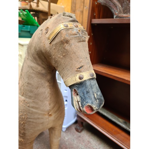 475 - A charming 19th century model horse, with super detail including a wooden muzzle and hooves, and lea... 