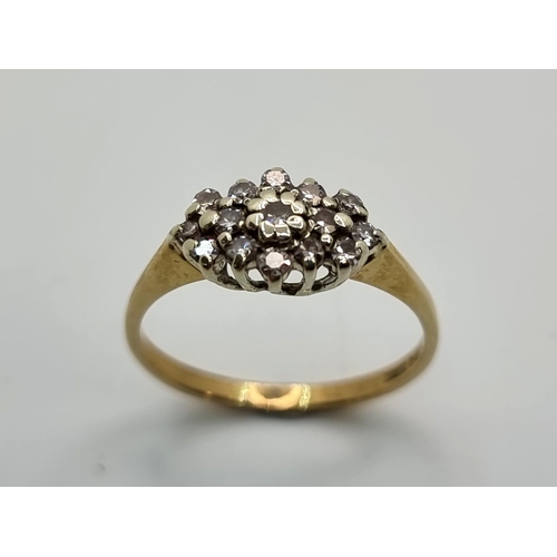 27 - A very pretty 9K gold diamond set cluster ring. Ring size M