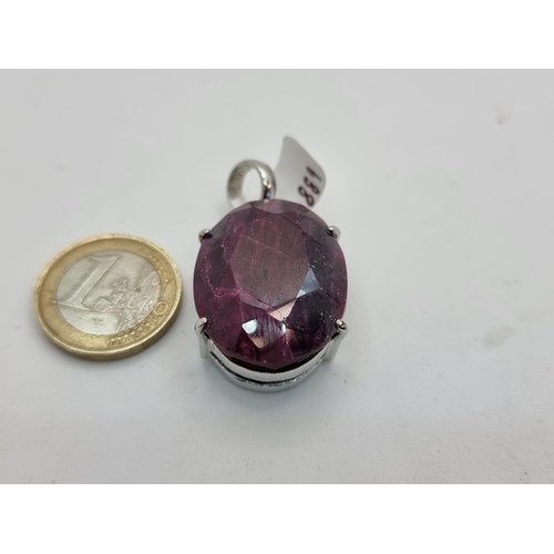 60 - A facet cut ruby stone pendant mounted in sterling silver. Total weight 21.8g.