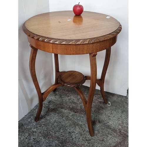 753 - A beautiful Edwardian golden mahogany circular occasion table, with rope edge surround  and standing... 