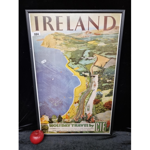 84 - A high quality print of an advertisement for Irish Holiday Travel by CIE showing a train by the coas... 