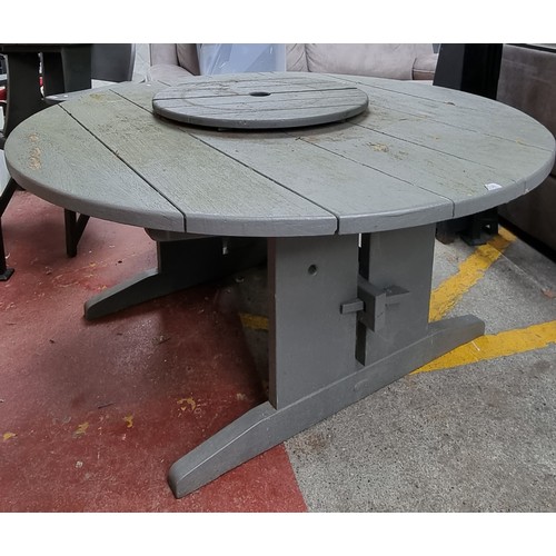 516 - Star Lot : A great quality, heavy wooden garden table  made from sycamore in a cool circular shape w... 