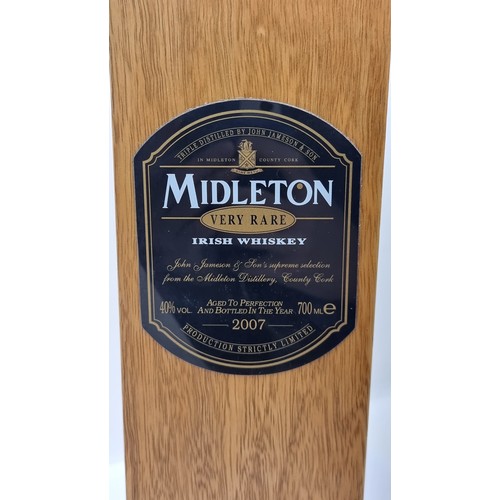 47 - A Middleton rare Irish whiskey box with Middleton bottle. Liquid contents not whiskey, seal broken.