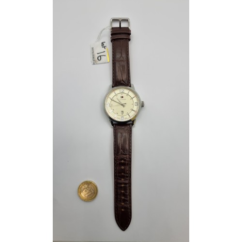 16 - A handsome Tommy Hilfiger wrist watch with genuine leather straps, glow in the dark digits and date ... 