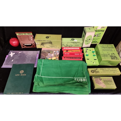 129 - Eleven 1970s Subbuteo accessories including the reference and log book (unused), a set of four goalk... 