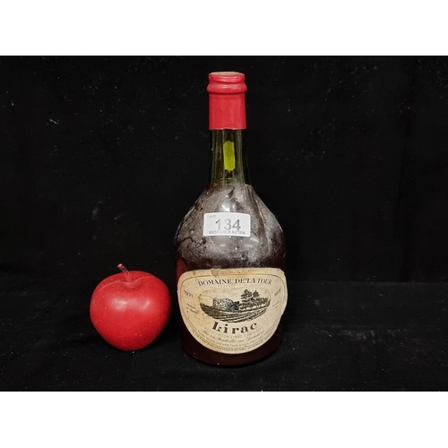 134 - A sealed 75 cl. bottle of 1971 Domaine De La Tour Lirac red wine.