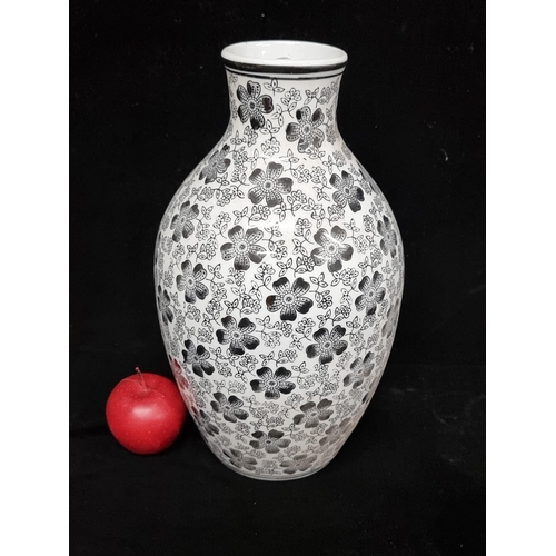 151 - A very large ceramic vase with narrow neck with lovely monochromatic floral pattern and black border... 