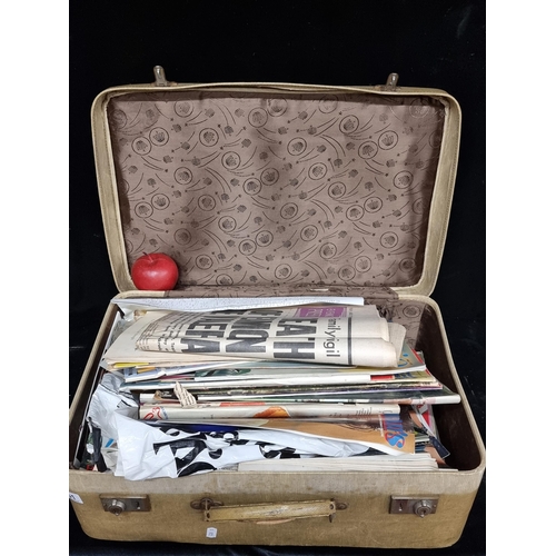 161 - A large vintage suitcase filled with a number (over 50) Irish magazines dating to the 1970s such as ... 