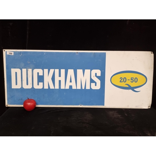 166 - A large vintage advertising sign for Duckham's 20/50 engine oil featuring bold text on a blue and wh... 