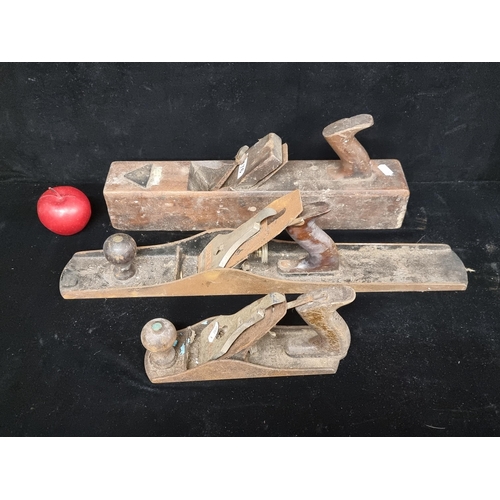 176 - Three vintage wood planes including two Stanley examples and one large wooden Campbells & Co. exampl... 