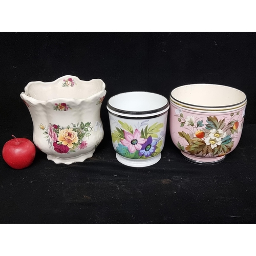 177 - Three vintage ceramic jardinières. Each decorated with floral patterns in varied styles. Including o... 