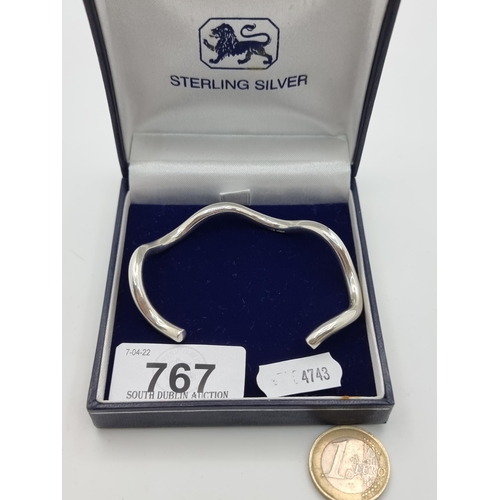 767 - Unusual shaped Sterling Silver bangle in presentation box. Nice weight