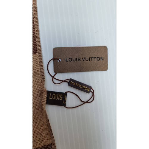 31 - An attractive Louis Vuitton scarf  dimensions 180 x 70cm. Scarf in good, clean condition with tags.