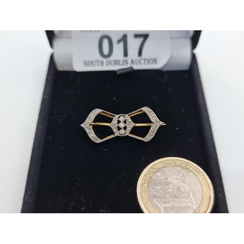 17 - A pretty 14K gold diamond set Art Deco  bow design brooch. Pin intact. Dimensions 3 x 1cm. Weight 2.... 