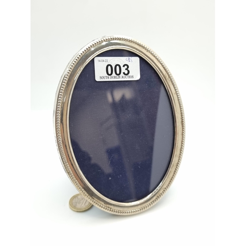3 - A sterling silver glazed oval photoframe, with velvet fittings to reverse. Internal dimensions 17 x ... 