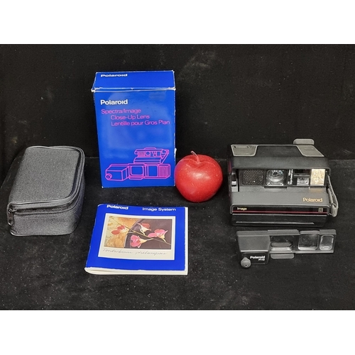 787 - A Polaroid brand Image System instant camera with a Polaroid close up lens for use with Spectra and ... 