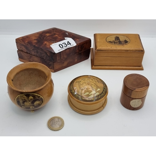 34 - A collection of five wooden treen items, including two Maughlin ware examples which depicts the Chap... 