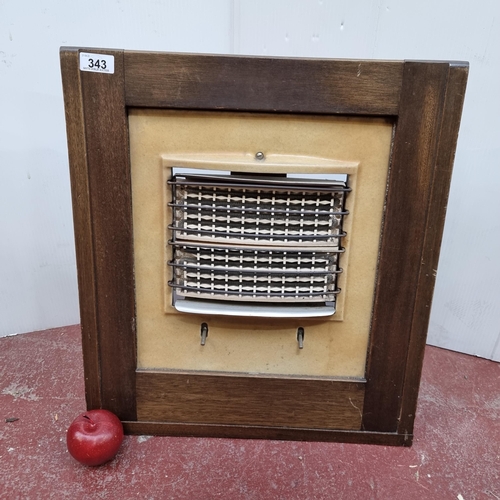 343 - A British made GEC 1940s electric heater with ceramic backing plate set into a wooden freestanding f... 