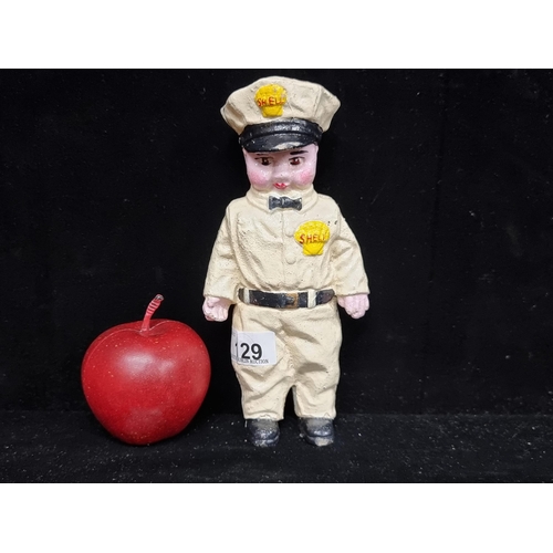 129 - A very heavy cast metal moneybox in the form of a Shell petrol pump attendant. A heavy and charming ... 