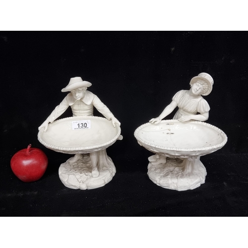 130 - Star Lot : A stunning pair of antique porcelain figural serving dishes c.1884, modelled by James Had... 