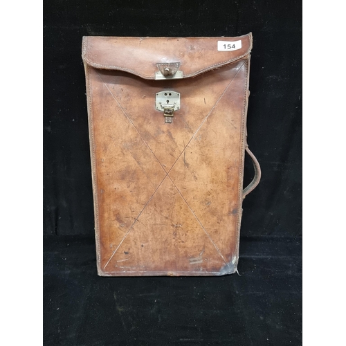 154 - A handsome 19 folio case, with beautifully aged tan leather, scarlet velvet interior and a sturdy le... 