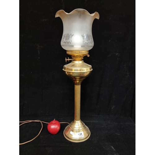 159 - A vintage brass oil lamp with a reeded column and a beautiful fluted glass shade with frosted detail... 