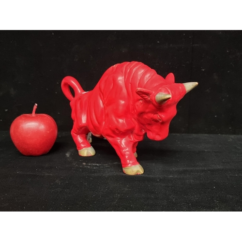 181 - A striking mid-century ceramic bull figure. In scarlet colour, with the bull posed to charge.