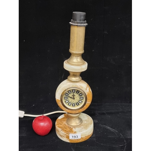 193 - A vintage lamp with a fantastic onyx and gilded metal base and stem inset with a German made clock. ... 