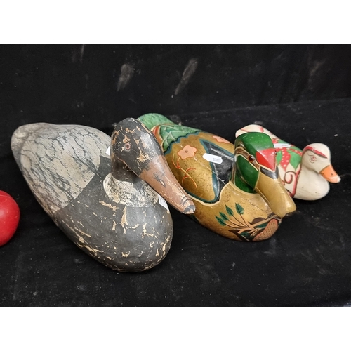 207 - Three wooden mallard ducks with hand-painted details. Including one example with amber glass eyes an... 