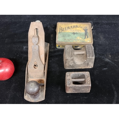 208 - Four vintage items including two cast iron weights by brands Poole (2lbs) and Newman (4lbs) with a S... 