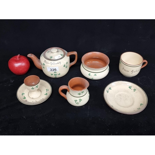 226 - A selection of seven pieces of ''Carrig Ware'' terracotta pottery. Each with a shamrock motif and cr... 