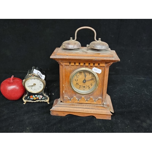 230 - A pair of vintage clocks including a musical example which plays the tune ''Deep in the Heat of Texa... 