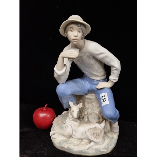 240 - A very large porcelain figure of an young man with lamb by Rex Valencia, hand painted in soft pastel... 