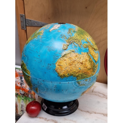 279 - A large light-up world globe with relief topographical details. Fabricated by Nova Edizione Rico Fir... 