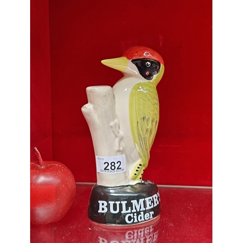 282 - A charming ceramic advertising figure for Bulmer's cider, in the form of a woodpecker.