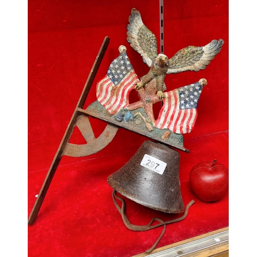 297 - A heavy cast metal, wall mounting bell in an American theme. Featuring an eagle balancing on crossed... 