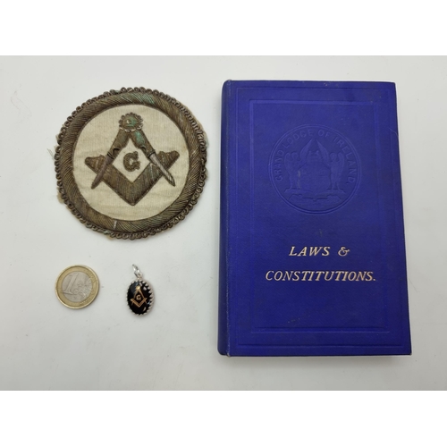3 - Three items of Masonic interest; a nicely embroidered Masonic badge, an engraved pendant and a bookl... 