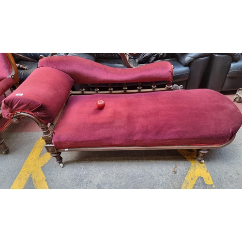 341 - An Edwardian chaise lounge with railed back and foliate scroll detail, supported by ceramic casters.... 