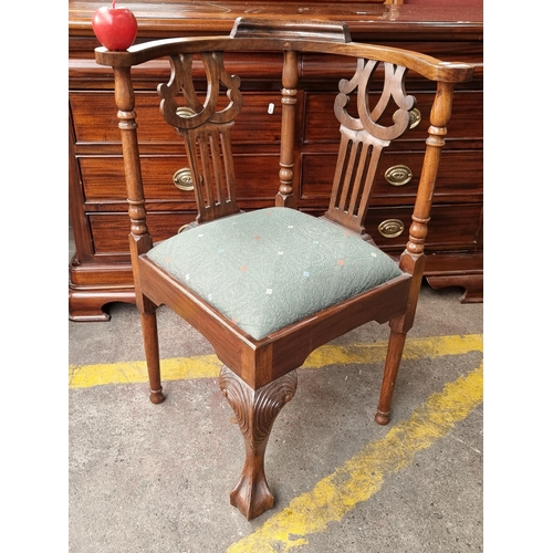 354 - A handsome example of Georgian style mahogany carved corner chair. With turned legs and ornately car... 