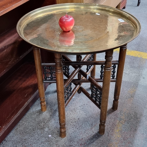 482 - A good sized vintage benares brass tray coffee table, with a lovely folding hardwood frame with turn... 